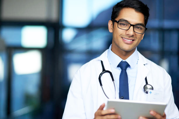 Portrait of a young doctor using a digital tablet in a hospital