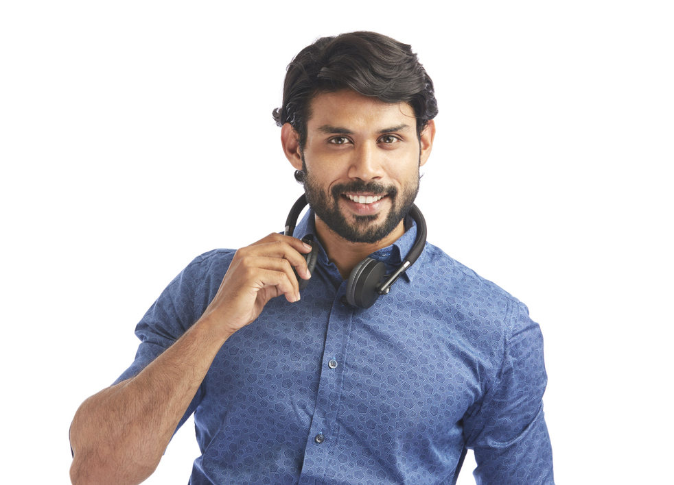 Young man wearing headphones on white.