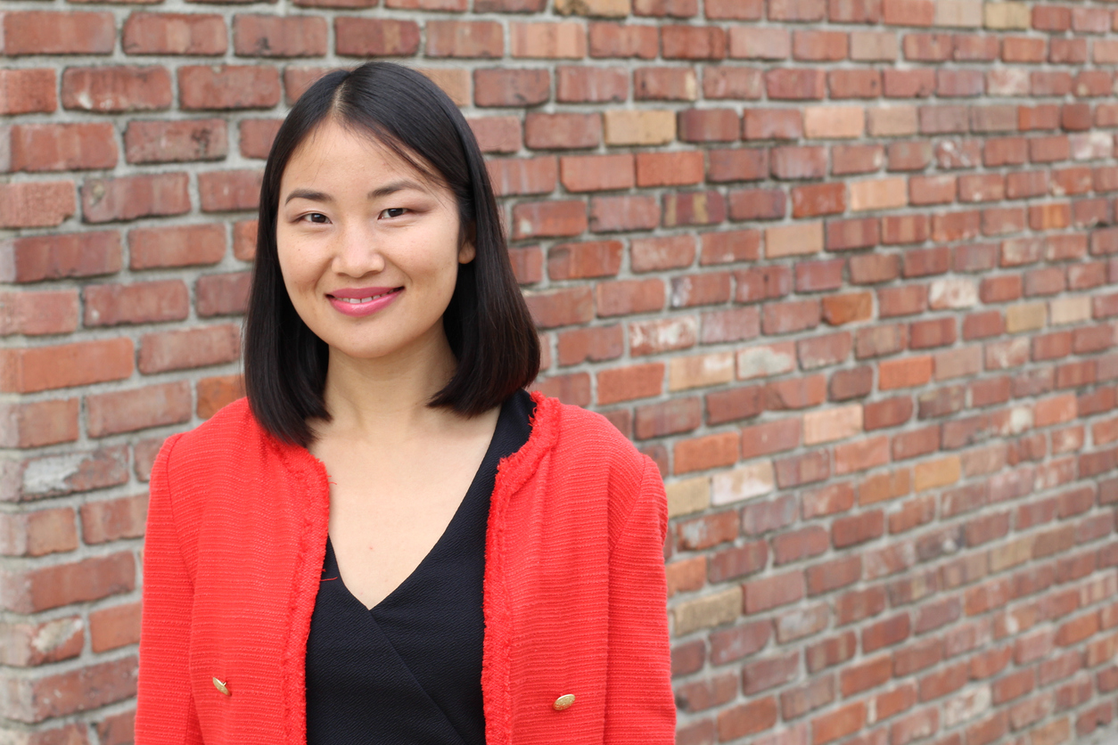 Cheerful looking Asian businesswoman with copy space.