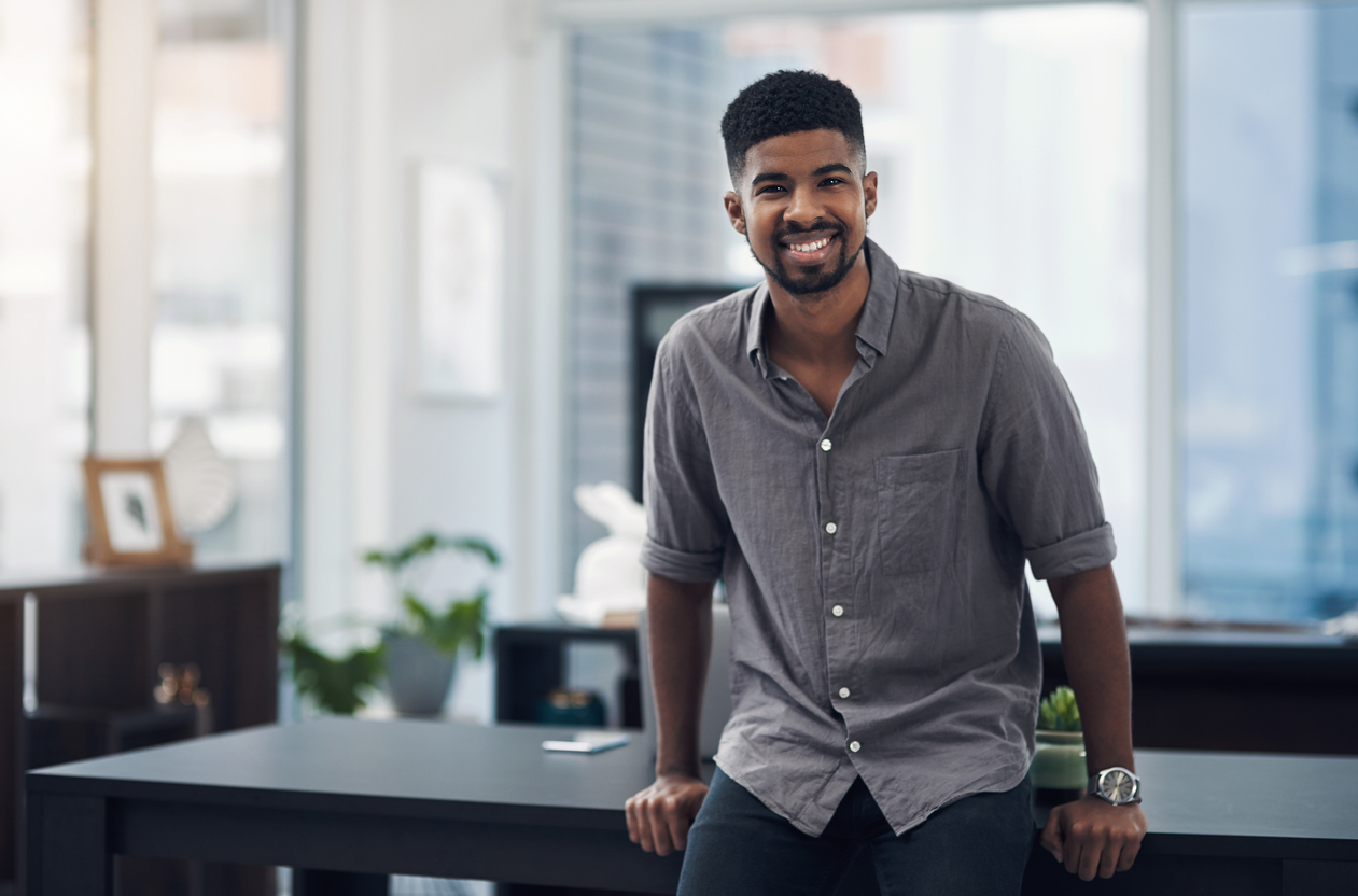 Portrait of a confident young businessman standing in an office