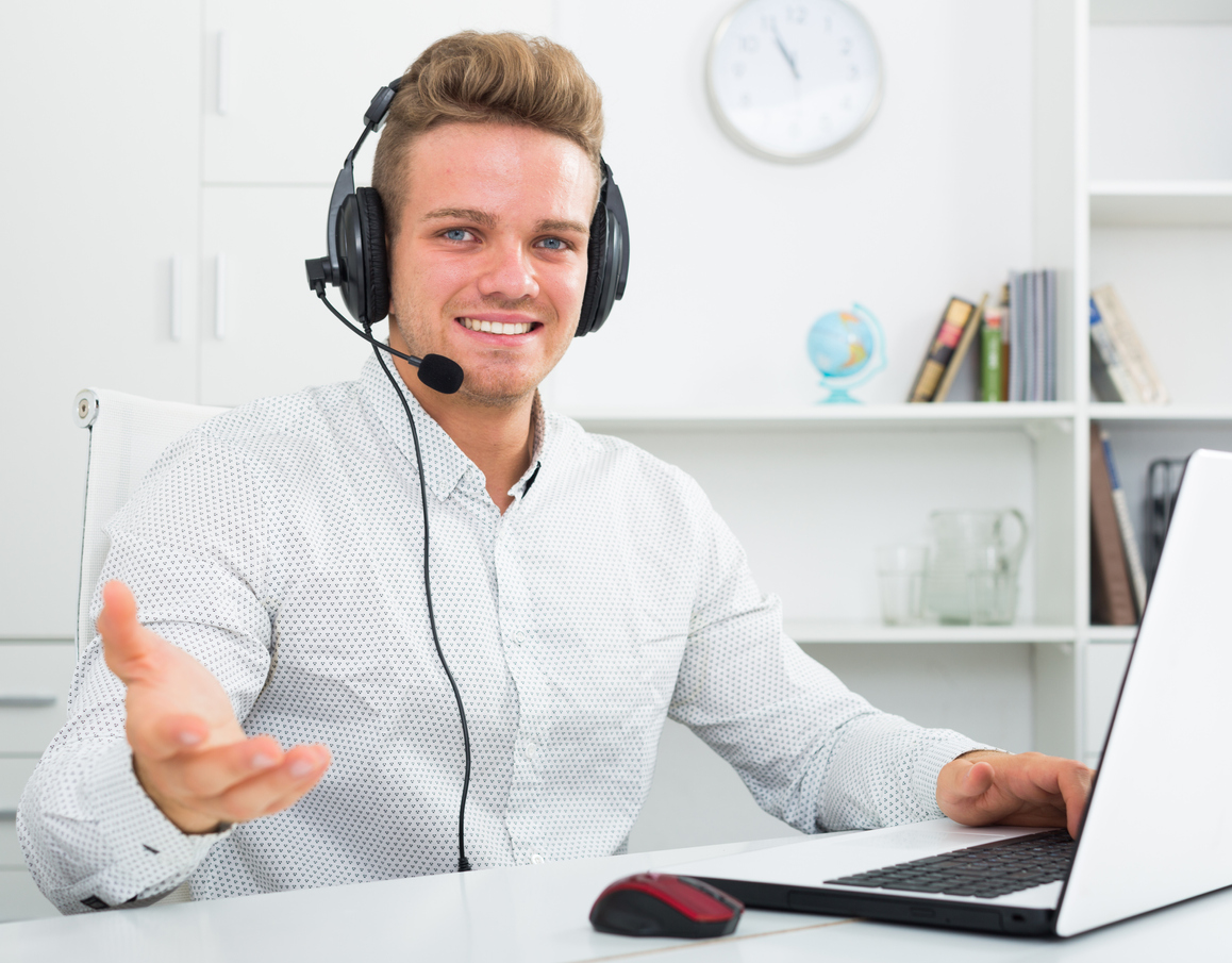 Young professional inviting to join him in call center